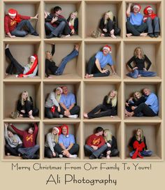 a group of people sitting on top of a wooden shelf with christmas hats in them