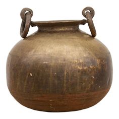 an old metal pot with two handles on it