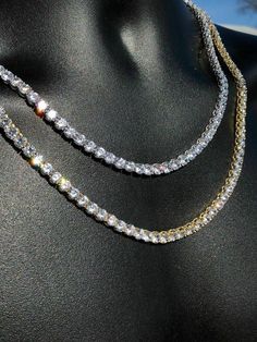 Gorgeous men's tennis chains.
Handmade
SOLID 925 Sterling Silver finished in rhodium or electroplated in 14k gold!
40-50ct man made diamonds...SO ICY THEY WILL BLIND YOU!
60-80 grams depending on length! Very heavy and solid weight
 
Never changes color! Why buy brass from others when you can get real solid silver with us!
LIFETIME GUARANTEE!
Chain lays flat and doesnt fold!

5mm thick
16-30" in length so you can wear as a choker or a longer chain!
 
Look great with a pend Gold Iced Out Round Tennis Necklace, Luxury Iced Out Tennis Necklace For Anniversary, Gold Iced-out Tennis Necklace, Classic Iced Out Tennis Necklace As Gift, Classic Iced Out Tennis Necklace Gift, White Gold Iced Out Tennis Necklace For Anniversary, Iced Out White Gold Tennis Necklace For Anniversary, Silver Iced Out Tennis Necklace For Anniversary, Mens Tennis