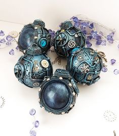 four blue ornaments are sitting on a table