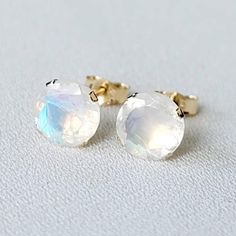 Illuminate your style with our genuine rainbow moonstone stud earrings. These earrings showcase the enchanting play of colors within the moonstone, creating a mesmerizing and ethereal effect. Meticulously crafted for a touch of mystique, these studs add a subtle yet magical elegance to your ensemble. Embrace the captivating beauty of rainbow moonstones and let your jewelry speak volumes. These earrings are available in your choice of a 14K gold-filled setting, 14k solid gold setting (yellow or w Yellow Gold Round Moonstone Earrings, Moonstone Yellow Gold Round Earrings, White Moonstone Birthstone Earrings, Moonstone Earrings Studs, Gold Faceted Moonstone Earrings, Rainbow Moonstone Earrings, White Gold Set, Moonstone Earrings, Black And White Pictures