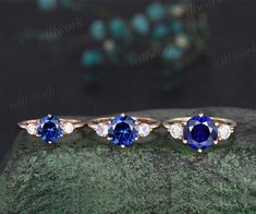 three different types of engagement rings with blue and white stones on top of each other