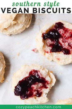 scones with jam and butter on them sitting on top of a white countertop