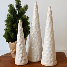 Elevate your festive mood with these unique Fingerprint Christmas Trees! These handcrafted ceramic trees add a touch of sophistication to your holiday decor. Available in small (8.5"), medium (11"), and large (12") sizes, you can mix and match to create your own personalized display. Get them all for a jolly woodland atmosphere! Fingerprint Christmas Tree, Fingerprint Christmas, Clay Christmas Tree, Ceramic Trees, Holiday Pottery, Homemade Clay, Clay Christmas, Pottery Inspo, Slab Pottery