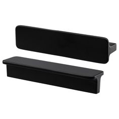 pair of black plastic shelf brackets on white background