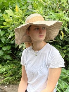 Floppy straw beach hat with natural linen ribbon and bow.Summer straw hat is perfect for wearing to the beach, a picnic, out and about in town on a warm, sunny day!Natural linen bowGrosgrain ribbon interior headband Brim size - 5 1/4”Full diameter - 18”Head size - 21”Wire in brim edge for shaping Sun n’ Sand HeadwearCondition is very good. Beige Beachy Straw Hat For Beach, Palm Leaf Sun Hat For Beach Season, Palm Leaf Summer Sun Hat For Vacation, Beige Summer Sun Hat For Vacation, Beachy Beige Sun Hat For Vacation, Natural Color Summer Sun Hat For Vacation, Beige Beachy Sun Hat For Vacation, Beige Boater Hat For Beach Season Vacation, Beige Boater Hat For Beach Vacation