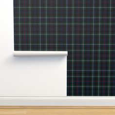 a wall with a black and green plaid pattern on it