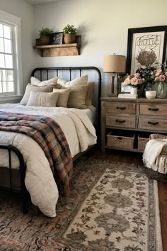 a bed sitting next to a window in a bedroom