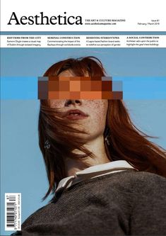 the front cover of aesthetica magazine featuring a woman with red hair and brown eyes