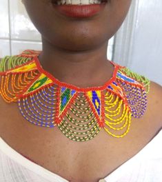 African wedding necklace, Zulu necklace, Beaded shawl necklace, African jewelry, Masai necklace, Bridesmaid necklace, Wedding giftThis stunning necklace is superbly crafted with fine beads.The necklace can be worn with any outfit at different occasions and it will absolutely makes you stand out.100% handmade using fine beads.Closure: ball jointColor: multicolor3-5 days delivery via DHL ExpressThe shipping fee is for the first item only and additional necklaces or items ship for free.Wholesale av Bridal Necklace With Colorful Round Beads, Bohemian Beaded Bib Necklace For Wedding, Bohemian Beaded Bridal Necklace, Bohemian Beaded Bridal Necklace For Wedding, Handmade Round Beads Choker For Wedding, Red Beaded Chain Necklace For Wedding, Large Bead Pearl Necklace For Wedding, Bohemian Bib Necklace For Wedding, Handmade Wedding Choker With Round Beads