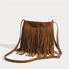 Discover the Ultimate Bohemian Accessory Introducing the perfect blend of style and functionality—our Vintage Suede Fringe Crossbody Bag. This exquisite shoulder bag embodies the essence of bohemian chic, elevating any outfit with its sophisticated flair and playful tassels. Designed for the modern woman who cherishes both elegance and convenience, this bag is a must-have accessory that complements every occasion, from the laid-back to the lavish. Key Features Charming Bohemian Style: Elevate your wardrobe with the bag’s elegant boho aesthetics. Trendy Tassel Decoration: Add a playful touch to your ensemble with chic, eye-catching tassels. Soft and Durable Material: Crafted from premium PU leather, offering both comfort and durability for daily use. Adjustable Shoulder Strap: Custom-fit to Boho Crossbody Bag, Fringe Crossbody Bag, Bohemian Accessories, Fringe Bags, Vintage Suede, Design Del Prodotto, Tassel Bag, Styl Boho, Magnetism