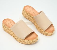 This fashionable flatform sandal pairs sleek leather with boho-chic raffia, creating a cool juxtaposition that's just as at home at the beach resort as it is in the city center. From Dolce Vita. Trendy Woven Leather Beach Sandals, Spring Beige Woven Leather Espadrilles, Beige Woven Leather Espadrilles For Spring, Beach Straw Wedge Sandals With Cork-bed Midsoles, Beige Platform Sandals For The Beach, Trendy Natural Straw Sandals, Casual Beige Espadrilles With Woven Leather, Casual Beige Woven Leather Espadrilles, Summer Platform Espadrilles In Natural Color