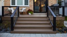 a house with stairs leading up to the front door