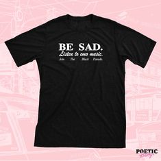 Be sad, Listen to emo music, Join the black parade <3 Designed by Poetic Betty Printed onto a super soft 100% cotton t-shirt. For sizing, please refer to the Unisex size guides pictured. UK - Size guide. XS - 3XL (100% organic cotton tee) USA - Size Guide. XS - 3XL (100% soft ringspun cotton tee) Black T-shirt With Text Print, Emo Style Cotton T-shirt With Graphic Design, Black Emo T-shirt For Summer, Emo Style Short Sleeve T-shirt With Text Print, Black Music-themed T-shirt With Letter Print, Unisex Emo T-shirt With Graphic Print, Emo Cotton T-shirt With Graphic Design, Black Unisex Emo T-shirt, Emo Short Sleeve T-shirt With Text Print