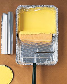 a piece of tin foil sitting on top of a table next to a paint roller