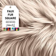 the label is attached to a furry animal's fur textured with multicolored squares