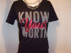 You are viewing a v neck fitted shirt with Know yours Worth in rhinestone and glitter vinyl material. Material Cotton and 5% spandex Style V neck fitted Color Black See the measurement below are across the chest areas and the shirt sizes. small - 15' (0-6) medium - 16" (6-8) Large - 17"( 8-10) XL - 18" (12-14) 1x - 21 (14-16) 2x - 23"(18-20) 3x' 26"(22-24) Fitted Bling Tops For Night Out, Fitted Rhinestone T-shirt For Party, Bedazzled Fitted Top For Night Out, Fitted V-neck Top With Rhinestones, Fitted Black T-shirt With Rhinestones, Fitted Short Sleeve Tops With Glitter Print, Black V-neck Tops With Rhinestones, Black V-neck Top With Rhinestones, Embellished Stretch V-neck Tops