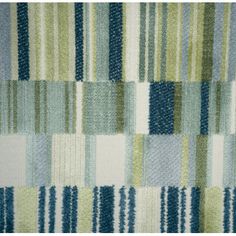 an upholstered area rug with blue, green and white stripes