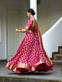 Saras the label brings you this Banarasi Lehenga in pink with pink choli and dupatta for your perfect celebrations. The set includes a stitched blouse with half sleeves style and designer neck in scoop back design and dori tie-up at the back. This Bandhani print Lehenga comes with a Bandhani print Pink Dupatta. The Flowy Banarasi silk fabric adds grace to the Lehenga Choli. Check out the photos of the product for a more detailed look.Lehenga:Fabric- Faux Banarasi silkColour- PinkPattern- Bandhan Benaras Lehenga Designs, Bandhani Ghagra Choli, Bandhani Lehenga Designs, Banaras Lehenga Designs, Bandhani Lehenga Ghagra Choli, Bhandej Lehenga, Bandhani Blouse Design, Pink Choli