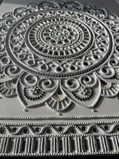 an intricate design is shown on the side of a building