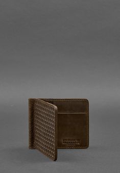 Elevate your everyday essentials with this Unique Elegant Men's Leather Wallet with Money Clip. Designed for those who appreciate both style and individuality, this wallet is crafted from luxurious leather that exudes sophistication. The unique design features a built-in money clip, providing a sleek and secure way to carry your cash while keeping the wallet slim and easy to carry. Inside, the wallet offers carefully arranged card slots and compartments, allowing you to organize your essentials with ease. The rich leather exterior not only enhances its elegant appearance but also ensures durability and timeless appeal. Dimensions: 4.3 x 3.7 inches. Modern Brown Wallets With Rfid Blocking, Modern Brown Wallets For Gift, Modern Brown Wallets For Gifts, Modern Brown Wallet For Gift, Modern Brown Card Holder With Coin Pocket, Brown Textured Leather Wallet For Business, Brown Textured Leather Business Wallet, Leather Wallets As Gifts, Modern Textured Leather Card Holder For Everyday