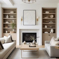 a living room filled with furniture and a fire place in front of a white fireplace