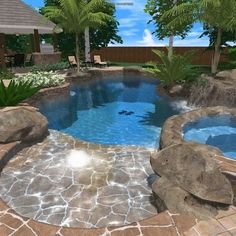 a small pool surrounded by rocks and palm trees