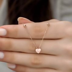 Crafted from high-quality sterling silver, this necklace is both stylish and durable, making it the perfect gift for a loved one on any occasion. Metal: 925 sterling silver; Coating: 18k rose gold Necklace length: 17"(42.5cm) + 2" (5cm) chain extender Chain style: cable link Hypoallergenic: nickel-free materials used therefore suitable for those with metal allergies Rose Gold Charm Necklace With Heart Pendant, Rose Gold Heart Pendant Charm Necklace With Delicate Chain, Rose Gold Heart Pendant Necklace, Delicate Rose Gold Heart Pendant Necklace, Delicate Rose Gold Heart Pendant Charm Necklace, Dainty Rose Gold Heart Pendant Charm Necklace, Rose Gold Heart Necklace With Adjustable Chain, Rose Gold Dainty Heart Necklace With Adjustable Chain, Dainty Rose Gold Heart Necklace With Adjustable Chain