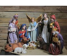 a nativity scene with figurines and animals