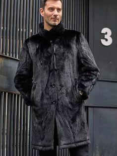 Men's Double Sided Long Fur Shearling Leather Coat In Black With this men's long fur shearling leather coat, you can up your winter look. This double-sided jacket is expanded in length and is made of genuine sheepskin leather with a semi-aniline finish and faux shearling lining. It delivers timeless warmth and sophistication in classic black and features a button fastening, a turn-down collar, and useful pockets. Outer Shell: Real Leather Leather Type: Sheepskin Leather Finish: Semi-aniline Inner Shell: Faux Shearling Feature: Double Sided Long Jacket With Black Fur Closure Style: Button Collar Style: Turn Down Inside Pockets: Two Outside Pockets: Two Side Pockets Color: Black Black Shearling Fur Coat For Cold Weather, Black Sheepskin Fur Coat With Faux Fur Lining, Black Sheepskin Long Coat, Black Sheepskin Fur Coat For Cold Weather, Luxury Black Fur Coat For Cold Weather, Black Long Winter Fur Coat, Luxury Black Long Fur Coat, Black Sheepskin Fur Coat For Winter, Black Long Faux Fur Coat