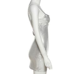 a white mannequin with an open back and mesh material on the sides, standing in front of a white background