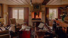 a living room filled with furniture and a fire place