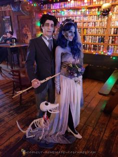 a man and woman dressed up in halloween costumes