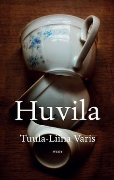 the cover of a book titled huvilla by julia varis on a wooden table