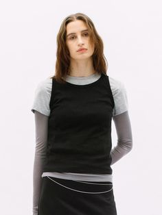 This is a feminine and modern top by WEARIS that is made out of high quality and sturdy material. With distinctive mood of the design and comfortable wear, you can style it for your comfortable daily outfit.- Tight fit layered t-shirt- Soft touch and high air permeability- Modern and minimal mood Versatile Fitted T-shirt, Modern Gray Cotton Tops, Modern Gray Cotton Top, Minimalist Black Top For Fall, Black Fitted Top For Layering, Fitted Black Top For Layering, Versatile Spring Tops For Streetwear, Versatile Spring Streetwear Tops, Gray Fitted Tank Top For Layering