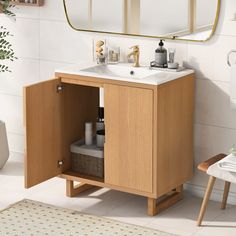 a bathroom with a sink, mirror and rug on the floor in front of it