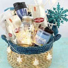 a basket filled with lots of items on top of a blue table next to a white snowflake