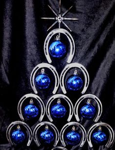 a christmas tree made out of blue ornaments