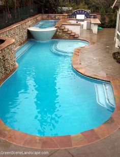 an empty swimming pool with steps leading up to it