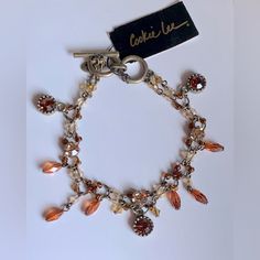 Genuine Crystal Antique Gold Tone Adjustable Double Stranded Beaded Dangle Toggle Bracelet By Cookie Lee * Nwt * Amber, Orange Tones * Rhodium Plated * Adjustable Toggle * Open Length: 8” Bundle & Save On Shipping And The More You Treat Yourself The Bigger The Discount You Will Receive! Ask Me Any Questions. I Want You To Be 100% Satisfied! Packaged With Care Just For You Fast Shipping Thank You For Visiting My Closet. Please Come Back Again Soon. Amber Beaded Bracelets, Elegant Orange Metal Bracelets, Elegant Orange Metal Bracelet, Vintage Beaded Bracelets For Jewelry Making, Adjustable Orange Beaded Bracelet With Lobster Clasp, Orange Beaded Bracelets, Travel Charm Bracelet, Cookie Lee Jewelry, Holiday Bracelets