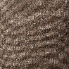 a brown and black tweed fabric textured with small dots on the top, as seen from above