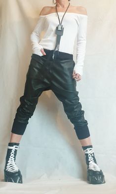 "Harem Women Trousers, Еco leather Pants, Black Loose Pants, Gothic Pants ❤️ Extravagant designs and high quality fabrics! ❤️ Materials & Care Eco Leather, Cotton Hand wash at low temperatures. Do not machine dry. Do not iron. Do not dry clean! ❤️ Sizing We can make your piece from XS to 5XL! Everything in the shop can be also made according to your measures free of charge! ❤️ Shipping ✈ Ready to ship The time I need to prepare an order for shipping varies. For details, see individual items. Black Loose Pants, Drop Crotch Pants Women, Leather Pants Black, Gothic Pants, Women Trousers, Gold Jacket, Drop Crotch Pants, Pantalon Large, Loose Pants