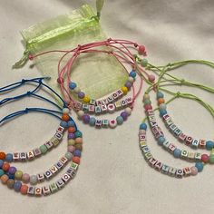 Going To The Eras Tour? Need Bracelets To Trade? Want Unique New Adjustable Taylor- Themed Friendship Bracelets? These Are For You! Set Of 9, Beaded Adjustable Bracelets With Mesh Drawstring Storage Bag, Nwt. Bracelets Are Handmade Using Neon Green, Pink & Blue Waxed Cotton Cord, Acrylic Square Multi Colored Letter Beads & Round 4mm Acrylic Beads. Bracelets Have Double Sliding Knots To Adjust The Size, Fits Wrist Size 6”-11”, Adjust To Fit Easily Over Your Hand, Perfect For Stacking & Trading. T Pink Adjustable Friendship Bracelets For Party Favors, Pink Letter Beads Friendship Bracelets For Party Favors, Customized Adjustable Pink Bracelet, Personalized Pink Friendship Bracelets For Party Favors, Adjustable Pink Beaded Bracelets For Party Favors, Trendy Pink Jewelry For Party Favors, Casual Customized Pink Name Bracelet, Pink Letter Beads Bracelets For Party Favors, Customized Cute Pink Friendship Bracelets