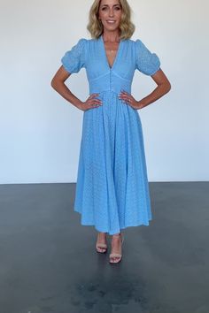 FINAL SALE Baltic Born exclusive style Versatile vintage inspired dress for every occasion Lightweight woven eyelet material Classic sky blue color Narrow deep v-neckline Gathered bust and shoulder seam Upward-v paneled bodice with center-back smocking Delicate ruffled detail around panel. Functional domed buttons down front of dress Puff sleeve with elastic cuff Midi-length skirt A-line skirt with vertical seaming Skirt lined to the knee, fully lined bodice Self: 97% Cotton, 3% Polyester, Linin Chic V-neck Eyelet Dress, Chic Eyelet V-neck Dress, Fitted Eyelet Dress, Midi Length, Fitted Eyelet Midi Dress, Fitted Eyelet Dress Midi Length, Chic Fitted Eyelet Midi Dress, Fitted V-neck Eyelet Dress, Fitted Eyelet Midi Dress For Summer, Fitted Eyelet Midi Dress For Daywear