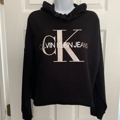 New For The Season** Signature Calvin Klein Black Cropped Raw Hem Sweatshirt Hoodie-Super Soft Cotton! Very Popular! Shoulder To Bottom Hem Is Approx 20” Nwt! What A Fun Casual Sweatshirt! Cheap Collared Tops By Calvin Klein, Fall Hooded Top With Logo Print, Spring Logo Print Hoodie, Casual Hoodie Tops With Logo Print, Black Logo Print Sweatshirt For Loungewear, Calvin Klein Logo Print Sweatshirt For Fall, Calvin Klein Crew Neck Sweatshirt With Ribbed Cuffs, Calvin Klein Long Sleeve Sweatshirt With Logo Print, Calvin Klein Winter Sweatshirt With Ribbed Cuffs