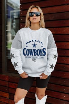 Make a bold statement with our Dallas Cowboys long sleeve crewneck fleece, designed to turn heads effortlessly. Featuring contrasting jersey mesh upper arm inserts and dazzling rhinestud stars on the sleeves, this fashionably unique piece ensures you stand out in any crowd. Nfc East, Upper Arms, National Football League, Dallas Cowboys, Unique Pieces, Dallas, Mesh, Crew Neck, Turn Ons