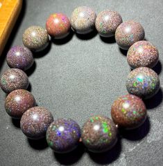 Material:Opal beads size :15mm   quantity: one strand  6mm approx 29 pcs one strands 7mm approx25 pcs one strands 8mm approx 22 pcs one strands 9mm approx 21pcs one strands 10mm approx 19 pcs one strands 11mm approx 18pcs one strands 12mm approx 16 pcs one strands 13mm approx 16 pcs one strands 14mm approx 15 pcs one strands 15mm approx 14pcs one strands 16mm approx 14 pcs one strands 17mm approx 13pcs one strands 18mm approx 13pcs one strands 19mm approx 12pcs one strands 20mm approx 12pcs one strands PLEASE NOTE: 1.Due to lighting effects, monitor's brightness/contrast settings etc, there could be some slight differences in the color tone of the pictures and the actual item. 2.Each piece of natural crystal is unique, the imperfections add natural characters to them. There might be small Opal Gemstone Beads Bracelets, Iridescent 8mm Round Bead Jewelry, Opal Gemstone Bracelets, Beaded Opal Bracelets, Iridescent Polished Round Beads Jewelry, Iridescent Jewelry With Polished Round Beads, Opal Beaded Bracelets With Round Beads, Iridescent Round Bead Bracelets, Iridescent Round Bracelets With 8mm Beads