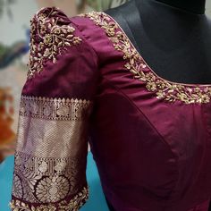 Discover this gorgeous purple silk blouse, adorned with intricate gold embroidery and unique tassel detailing. Perfect for bridal and party wear, this elegant design features puff sleeves and a stunning back pattern. Ideal for those searching for stylish saree blouses, bridal blouses, or party wear blouses. Elevate your traditional look with this exquisite piece!" Elegant Bridal Blouse Designs, Brown Maggam Work Blouse Designs, Brinjal Colour Blouse Design, Cap Sleeves Blouse Indian, Neckline Work Designs, Maroon Blouse Embroidery Designs, Maroon Silk Blouse Designs, Maroon Saree Blouse Design, Maroon Silk Saree Blouse Designs