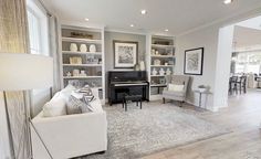 a living room filled with furniture and a piano