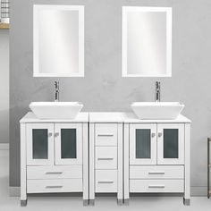 two white sinks and mirrors in a bathroom